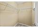 Walk-in closet with a light beige wall and wire shelving installed for optimal storage at 8013 Morrell Ln, Durham, NC 27713
