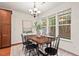 Charming dining room with modern chandelier lighting and a stylish table for memorable Gathering meals at 8013 Morrell Ln, Durham, NC 27713