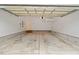 Empty two car garage with concrete flooring and lots of storage space at 8013 Morrell Ln, Durham, NC 27713