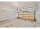 The garage offers concrete floors, neutral walls, and overhead storage at 8013 Morrell Ln, Durham, NC 27713