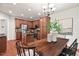 Stylish kitchen with stainless steel appliances and a central island, seamlessly connected to a dining area at 8013 Morrell Ln, Durham, NC 27713