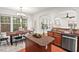Spacious eat-in kitchen with stainless steel appliances, ideal for cooking and entertaining guests at 8013 Morrell Ln, Durham, NC 27713