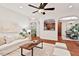 Cozy living room with a comfortable sofa, stylish coffee table, and hardwood floors, perfect for relaxation at 8013 Morrell Ln, Durham, NC 27713