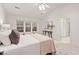 Inviting main bedroom featuring vaulted ceilings, ample natural light and neutral decor at 8013 Morrell Ln, Durham, NC 27713