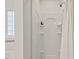 The bathroom features a stand-up shower with built-in shelving, and is well-lit at 8013 Morrell Ln, Durham, NC 27713