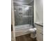Modern bathroom with sleek gray tiles, a glass-enclosed shower, and a stylish vanity at 805 Da Vinci St, Durham, NC 27704
