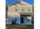 Charming two-story home featuring vertical siding, a covered porch, and neatly trimmed windows at 805 Da Vinci St, Durham, NC 27704