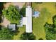 Aerial view of home with deck, pool, outbuildings, and verdant surrounding landscape at 8089 Crawford Currin Rd, Oxford, NC 27565