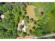 A serene home nestled amidst lush greenery on an expansive lot at 8089 Crawford Currin Rd, Oxford, NC 27565