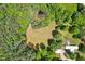 An aerial view of a home surrounded by lush greenery and trees, offering privacy at 8089 Crawford Currin Rd, Oxford, NC 27565