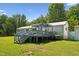 Charming home featuring a large deck, perfect for outdoor entertainment and relaxation at 8089 Crawford Currin Rd, Oxford, NC 27565