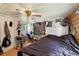 Bedroom with closet and windows, furnished with a bed and desk at 8089 Crawford Currin Rd, Oxford, NC 27565