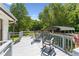 Enjoy outdoor living on this spacious deck with rocking chairs and tranquil views at 8089 Crawford Currin Rd, Oxford, NC 27565