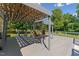 Spacious deck featuring a cozy pergola with comfortable seating, perfect for relaxing at 8089 Crawford Currin Rd, Oxford, NC 27565