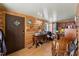 Bright office space with wood paneled walls, desk, and decorative fish wall hanging at 8089 Crawford Currin Rd, Oxford, NC 27565