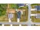Overhead view shows a home with a lovely backyard patio and landscaped lawn at 95 Buckthorn Dr, Youngsville, NC 27596