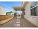 Screened-in back porch with stepping stone path to gravel area at 95 Buckthorn Dr, Youngsville, NC 27596