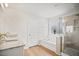 Modern bathroom featuring separate shower and bath, double sinks, and wooden floors at 95 Buckthorn Dr, Youngsville, NC 27596