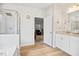 Bright bathroom features a tub, glass-enclosed shower, and a door to the main bedroom at 95 Buckthorn Dr, Youngsville, NC 27596