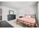 Bright bedroom featuring carpeted floors, white walls and trim, a bed, and a dresser at 95 Buckthorn Dr, Youngsville, NC 27596