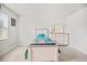 Bright bedroom featuring carpeted floors, white walls and trim, and a twin bed with colorful bedding at 95 Buckthorn Dr, Youngsville, NC 27596