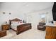 This bedroom boasts carpet floors, a cozy recliner, and a decorative wooden bed frame at 95 Buckthorn Dr, Youngsville, NC 27596