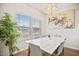 Bright dining room featuring a modern chandelier and stylish decor at 95 Buckthorn Dr, Youngsville, NC 27596