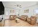 Comfortable living room with hardwood floors, neutral decor, and natural light from a glass panel door at 95 Buckthorn Dr, Youngsville, NC 27596
