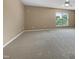 Spacious and serene bedroom featuring plush carpeting and ample natural light at 1005 Augustine Trl, Cary, NC 27518