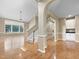 Open concept living room with hardwood floors and abundant natural light from large windows at 1005 Augustine Trl, Cary, NC 27518