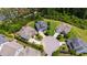 Aerial view of a cul-de-sac featuring mature trees, landscaping, and manicured lawns at 102 Bella Rose Drive, Chapel Hill, NC 27517