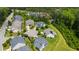 Aerial view of homes nestled in a neighborhood with mature trees and well-manicured lawns at 102 Bella Rose Drive, Chapel Hill, NC 27517