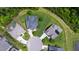 Aerial view of the property showcasing its location in a neighborhood with lush greenery and mature trees at 102 Bella Rose Drive, Chapel Hill, NC 27517