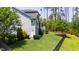 A home's fully fenced backyard featuring a lush lawn, mature trees, and privacy at 102 Bella Rose Drive, Chapel Hill, NC 27517