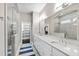 Bright bathroom features dual sinks, walk-in closet, and glass enclosed shower at 102 Bella Rose Drive, Chapel Hill, NC 27517