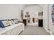 Bedroom with a trundle bed, eclectic art and decor, and an open doorway, creating a unique and inviting living space at 102 Bella Rose Drive, Chapel Hill, NC 27517