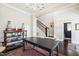 Formal dining room features hardwood floors, elegant decor, and staircase to the second level at 102 Bella Rose Drive, Chapel Hill, NC 27517
