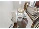 Grand foyer featuring staircase, statement chandelier, and wood floors with rug at 102 Bella Rose Drive, Chapel Hill, NC 27517