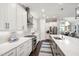 Modern kitchen featuring white cabinetry, stainless steel appliances, and quartz countertops at 102 Bella Rose Drive, Chapel Hill, NC 27517
