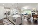 Open-concept kitchen with a large island and seamless flow into the living area at 102 Bella Rose Drive, Chapel Hill, NC 27517