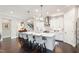 Spacious kitchen featuring a large island with seating and stylish pendant lighting at 102 Bella Rose Drive, Chapel Hill, NC 27517
