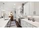 Modern kitchen featuring stainless steel appliances, white cabinets and a subway tile backsplash at 102 Bella Rose Drive, Chapel Hill, NC 27517