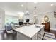 Open-concept kitchen with a large island and seamless flow into the living area at 102 Bella Rose Drive, Chapel Hill, NC 27517