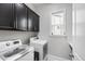 Laundry room with window and front loading washer and dryer at 102 Bella Rose Drive, Chapel Hill, NC 27517
