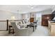 Upstairs sitting room features cozy seating, ceiling fan, natural light, and stylish decor, creating an inviting and relaxing atmosphere at 102 Bella Rose Drive, Chapel Hill, NC 27517