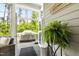 Sunroom with view to backyard grill on the back deck at 102 Bella Rose Drive, Chapel Hill, NC 27517