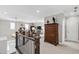 Spacious upper level hallway featuring a seating area and dark wood accents at 102 Bella Rose Drive, Chapel Hill, NC 27517