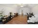 Large bonus room offering flexible space with hardwood floors, ceiling fan, and abundant natural light at 102 W Hill Dr, Cary, NC 27519