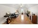 Spacious bonus room with hardwood floors, vaulted ceiling, a ceiling fan, and versatile layout perfect for any hobby at 102 W Hill Dr, Cary, NC 27519