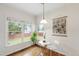 Cozy breakfast nook with a small table, chairs, and backyard views at 102 W Hill Dr, Cary, NC 27519